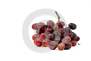 Bunch of small red grapes isolate on white background