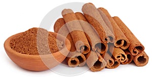 Bunch of some fresh aromatic cinnamon with powder spice