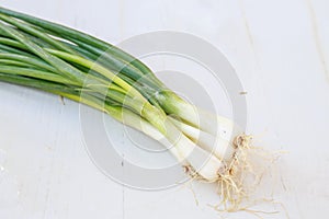 Bunch of spring onions on wooden