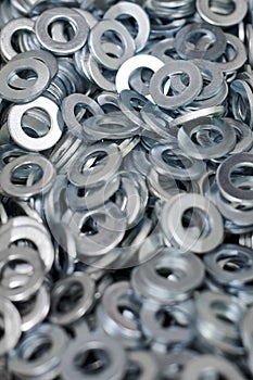 Bunch of stainless steel galvanized flat washers for fastener screws, nuts or bolts