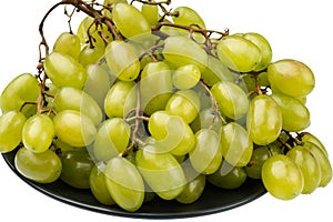 A bunch of table grapes in a plate on a white background isolated