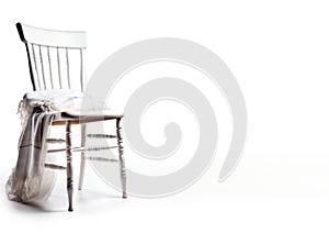 A bunch of things are lying on a chair, a mess. White background, isolate. AI generated