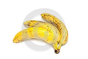 A bunch of three overripe bananas close-up isolated on a white background.