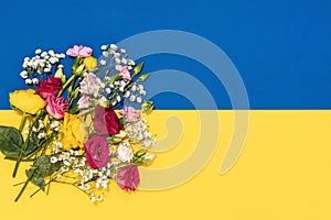 Bunch of tiny flowers and Ukrainian flag