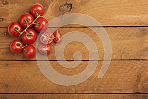 Bunch tomatoes on wood