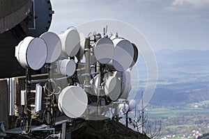 Bunch of transmitters and aerials on telecommunication tower