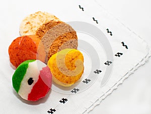 Bunch of typical mexican coconut candies honey cocada traditional mexican flag carpet background isolated colors