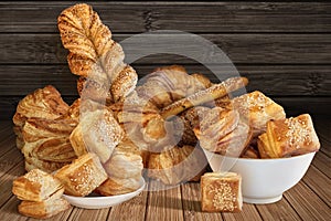 Bunch Of Various Sesame Cheese Puff Pastry And Croissant Set On Rustic Bamboo Place Mat