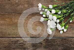 Bunch White Carnation Flower Bouquet Arrangement composition Isolated Rustic Wooden Background photo