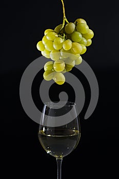 Bunch of white grapes on a crystal glass. photo