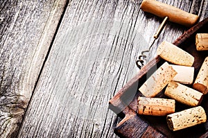 Bunch of wine corks and corkscrew photo