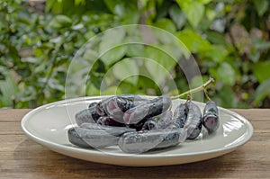 bunch of witch finger grapes on white plate