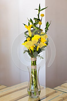 Bunch of yellow callas in the vase