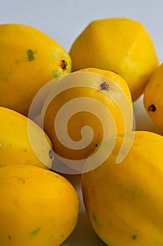 Bunch of yellow or golden passion fruit on white background