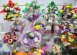 bunches of big fresh orange pink red gerbera chamomile rose and big white yellow blue chrysanthemum flower