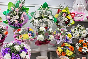 bunches of big fresh orange pink red gerbera chamomile rose and big white yellow blue chrysanthemum flower