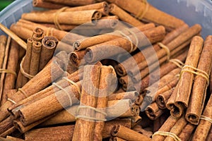 Bunches of cinnamon sticks in a herbal shop
