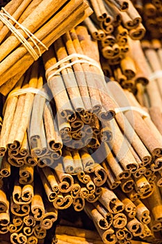 Bunches of cinnamon sticks in a herbal shop