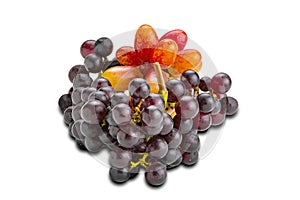 Bunches of freshly harvested ripe red grapes, purple grapes, isolated on white background