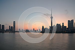 The Bund early in the morning at sunrise. Pudong and Huangpu river from The Bund in Shanghai, China