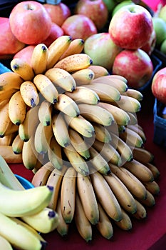 Bundle of Bananas and Apples on Sale Display at Farmers Market