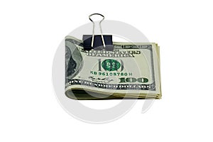 Bundle of bills of american one hundred dollars in paper clip isolated on white background