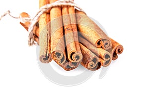 Bundle of cinnamon sticks isolated on white background