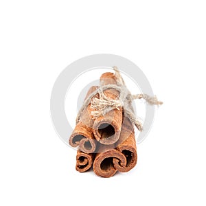 Bundle of cinnamon sticks on white background.