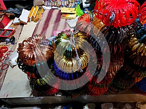 A bundle of colorful bangles on sale along the roadside in an Indian village