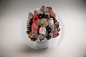 A bundle of edible flowers, arrangement of strawberries covered with chocolate for birthdays, valentine`s day, anniversary,