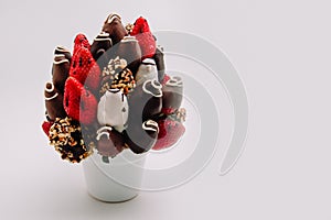 A bundle of edible flowers, arrangement of strawberries covered with chocolate for birthdays, valentine`s day, anniversary,