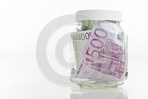 Bundle of European Currency Banknotes Put in Jar