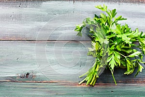 Bundle of Fresh Parsley over Painted Table Top