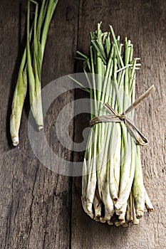 Bundle of Lemon Grass on wood background.