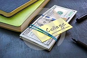 Bundle of money with the inscription college. Tuition payment.