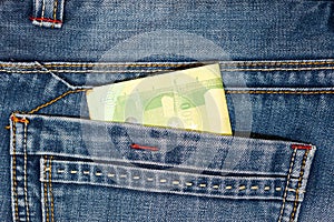 Bundle of money in jean pocket