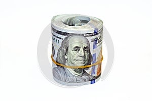 Bundle of money roll of dollars isolated on white background, stack of one hundred dollars American cash money bills rolled up