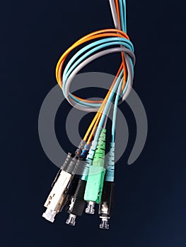 Bundle of three fiber optic patch cords with connectors arranged in a knot