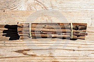 Bundle twigs on wooden table