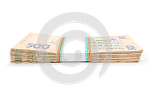 Bundle of Ukrainian money isolated on white background, 500 hryvnia. money concept. Lots of banknotes. Side view.