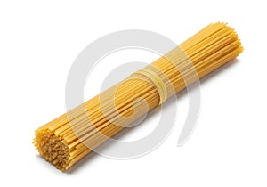 Bundle of uncooked spaghetti pasta isolated on white background
