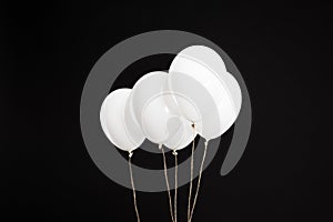Bundle of white helium balloons