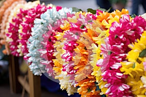 bundles of colorful leis for hawaiian-style birthday