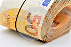 Bundles of 50 euro banknotes, isolated on white photo
