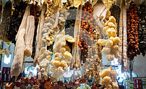 Bundles of sun dried vegetables hanging up at Turkish bazaar