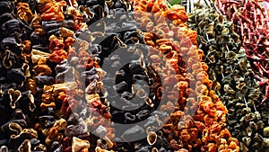 Bundles of sun dried vegetables hanging up at Turkish bazaar