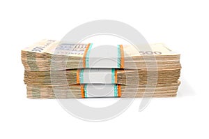 Bundles of Ukrainian money isolated on white background, stacks of hryvnia, 200 500. money concept. Lots of banknotes. Side view.