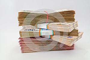 Bundles of Ukrainian money, stacks of hryvnia, 200,500. money concept. Lots of banknotes. Side view. White background