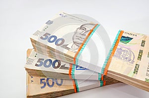 Bundles of Ukrainian money, stacks of hryvnia, 500. money concept. Lots of banknotes. Black background.