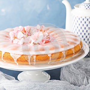 Bundt cake with frosting. Festive treat spring flowers